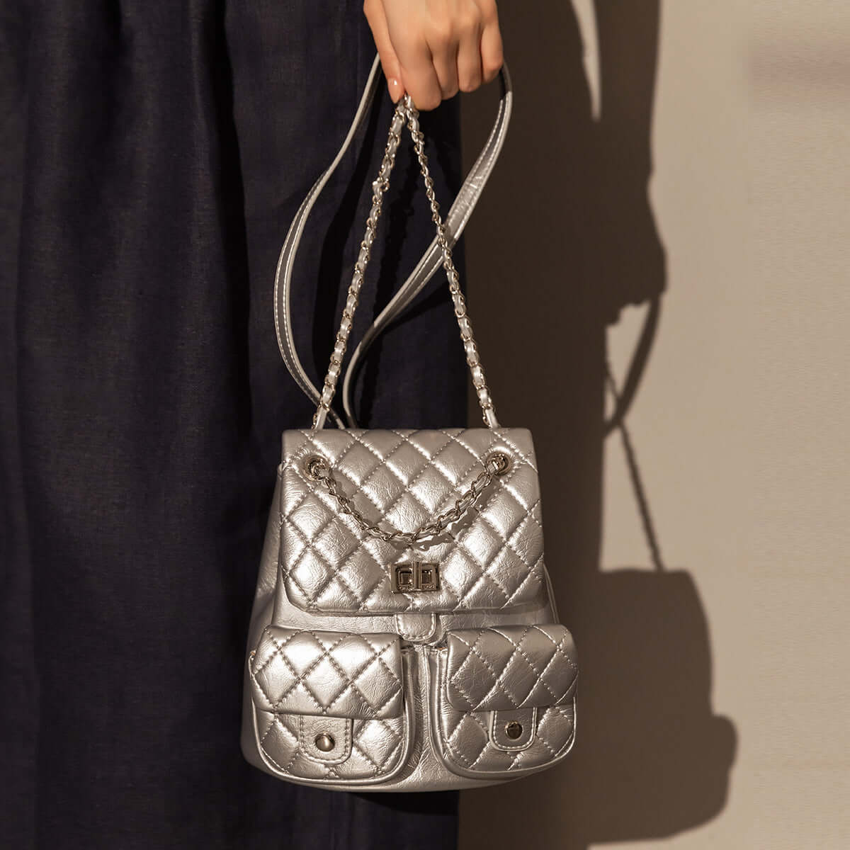 multi pocket chainstrap quilted backpack silver 1