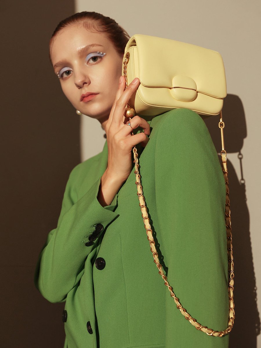 Structured Buckle Leather Shoulder Bag – Sculptural Lambskin Flap Bag with Gold Chain Strap