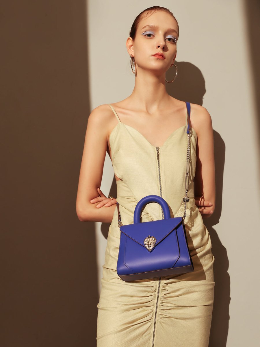 Avant Garde Silver Chain Strap Leather Top Handle Bag – Swan Handle Calfskin Bag with Ornate Lion Clasp