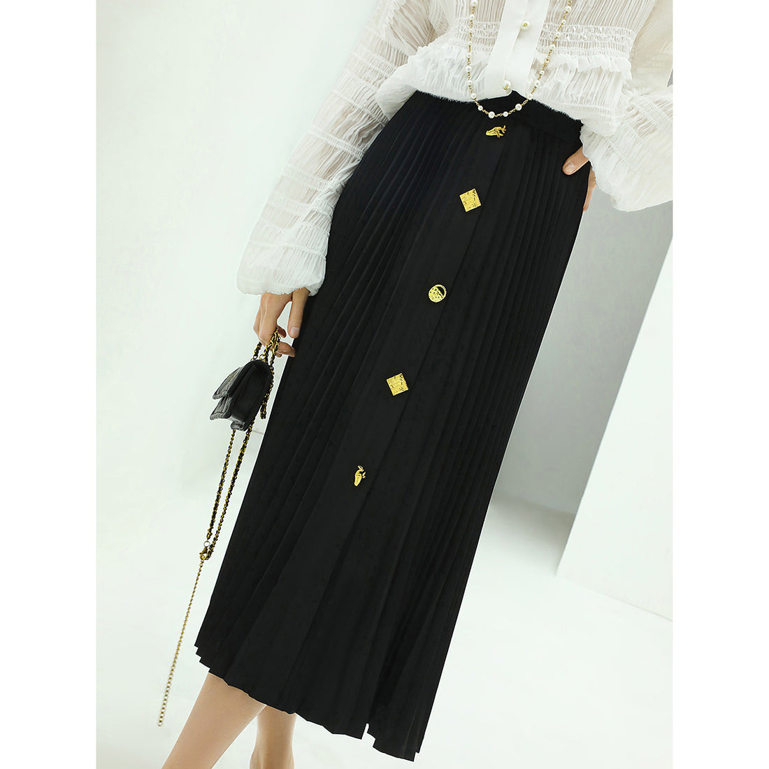 black-pleated-skirt-with-gold-metal-buttons_all_black_1.jpg