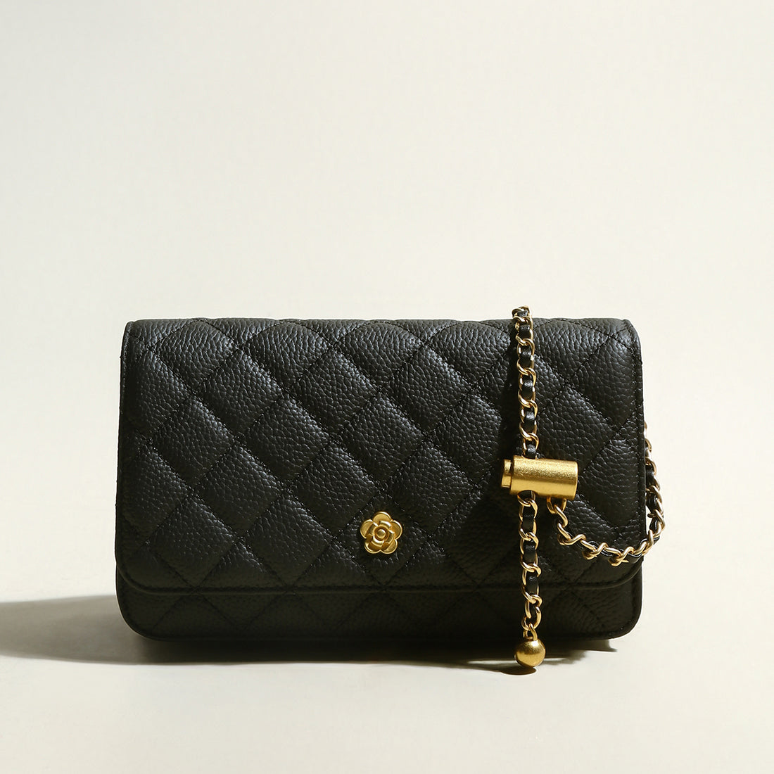 black-quilted-bag-with-golden-cylinder-chain-straps_black_1.jpg