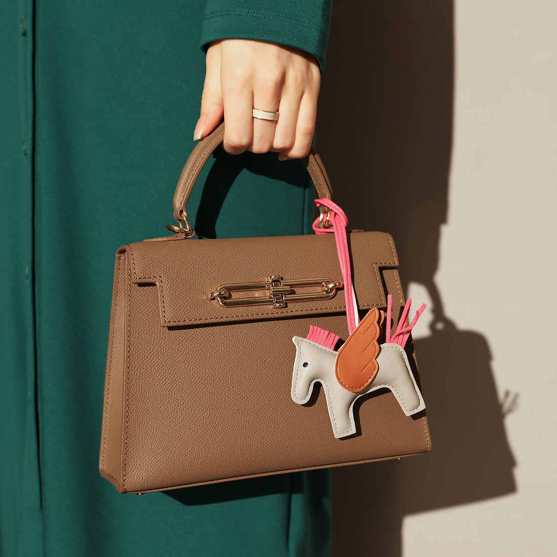 classic-handbag-with-a-unicorn-bag-charm_brown_1.jpg