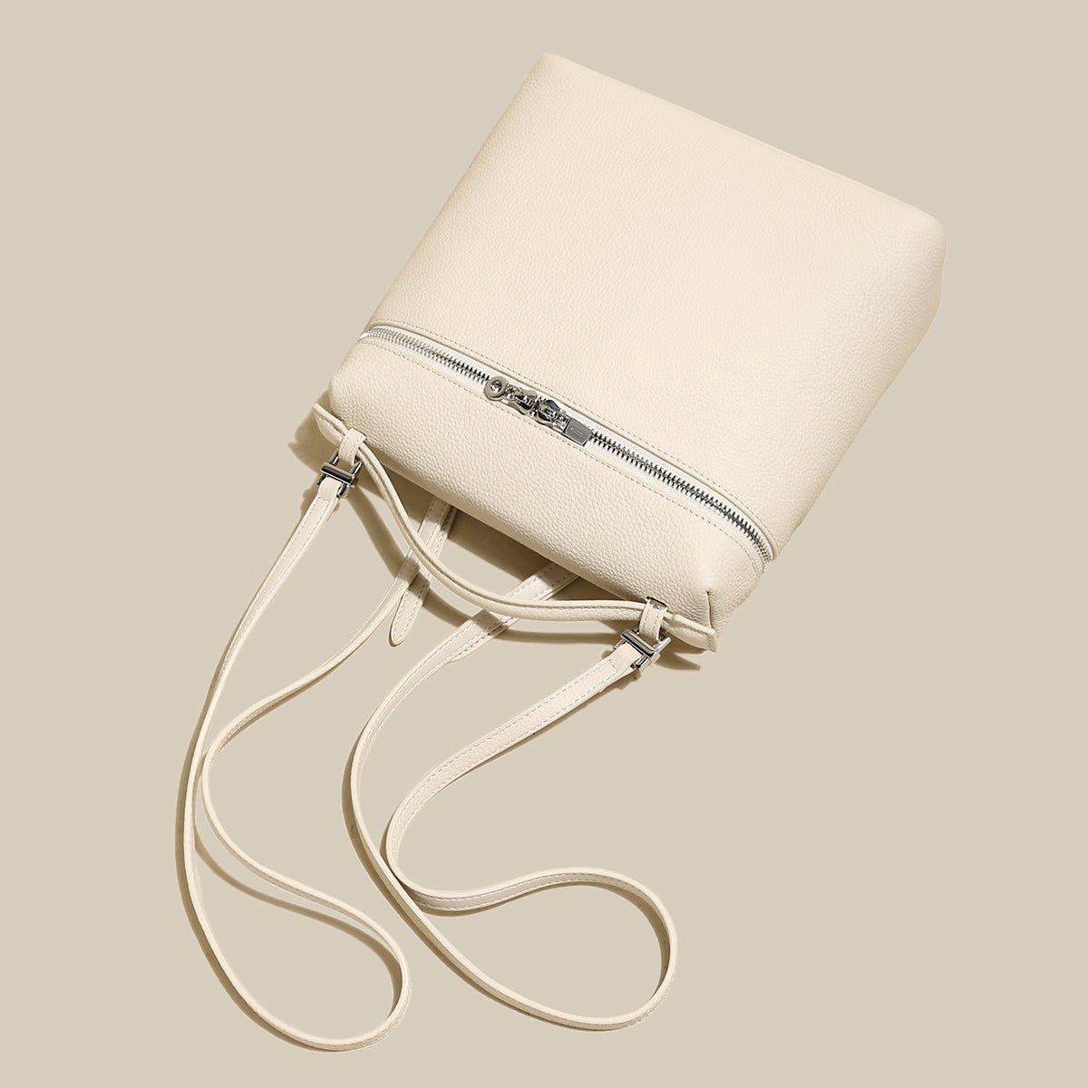 Convertible Pebbled Leather Backpack – Trapezoid Top-Handle Bag with Double Zip & Padlock Detail