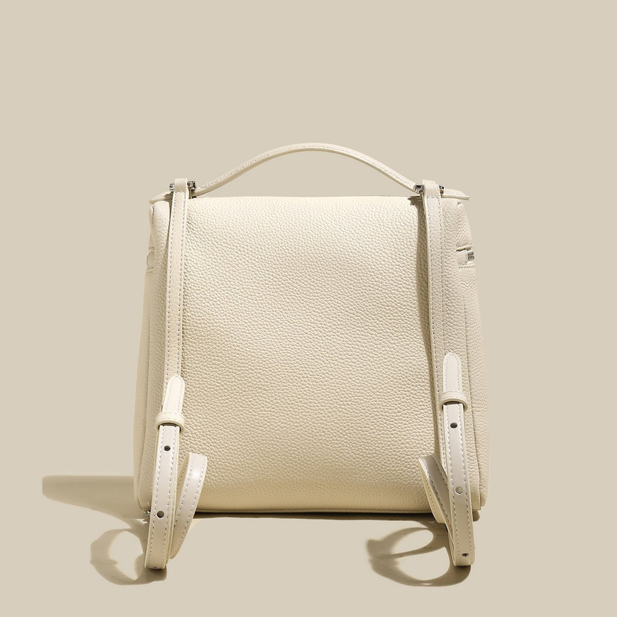 Convertible Pebbled Leather Backpack – Trapezoid Top-Handle Bag with Double Zip & Padlock Detail