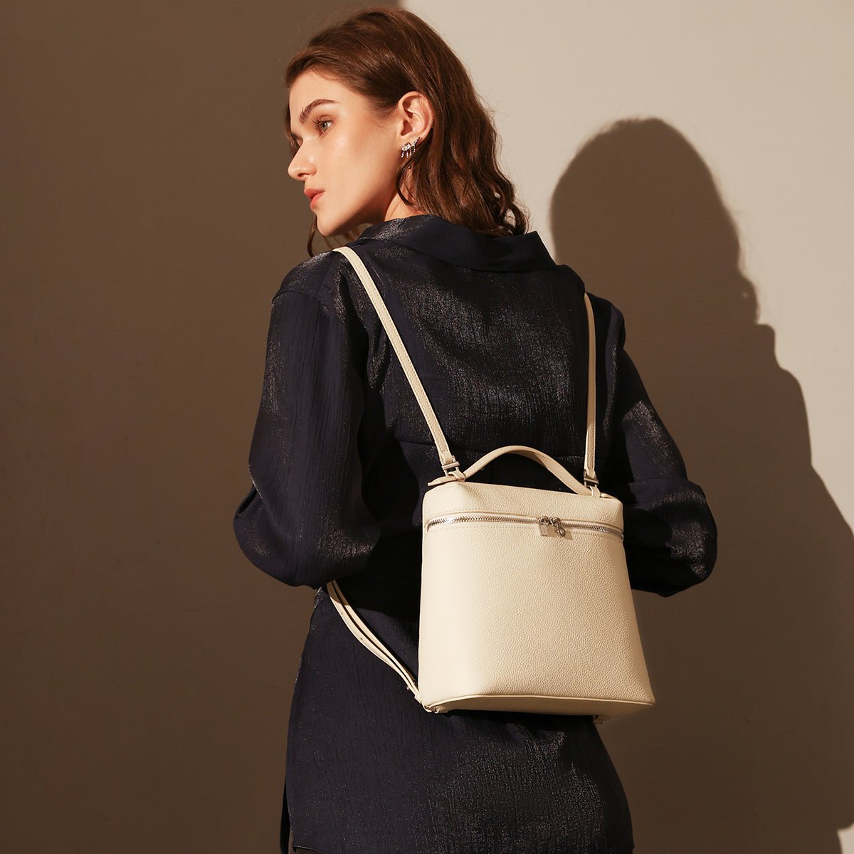 Convertible Pebbled Leather Backpack – Trapezoid Top-Handle Bag with Double Zip & Padlock Detail