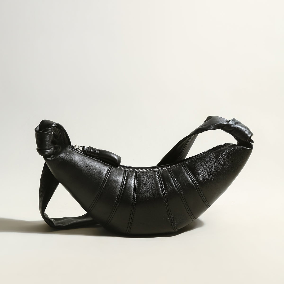 Croissant Chic Shoulder Bag – Sculptural Pleated Goatskin Leather Crescent Bag with Knotted Strap Detail
