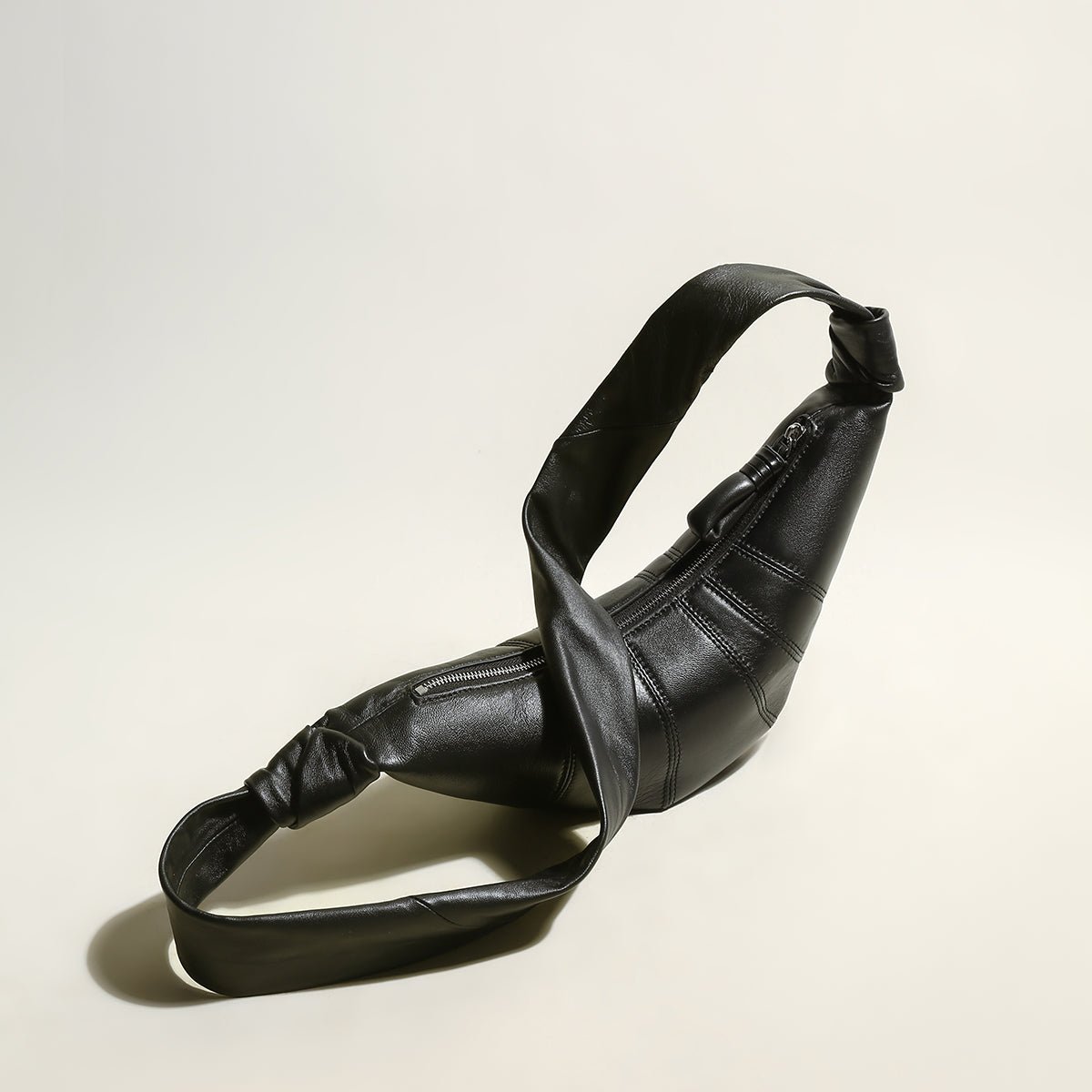 Croissant Chic Shoulder Bag – Sculptural Pleated Goatskin Leather Crescent Bag with Knotted Strap Detail