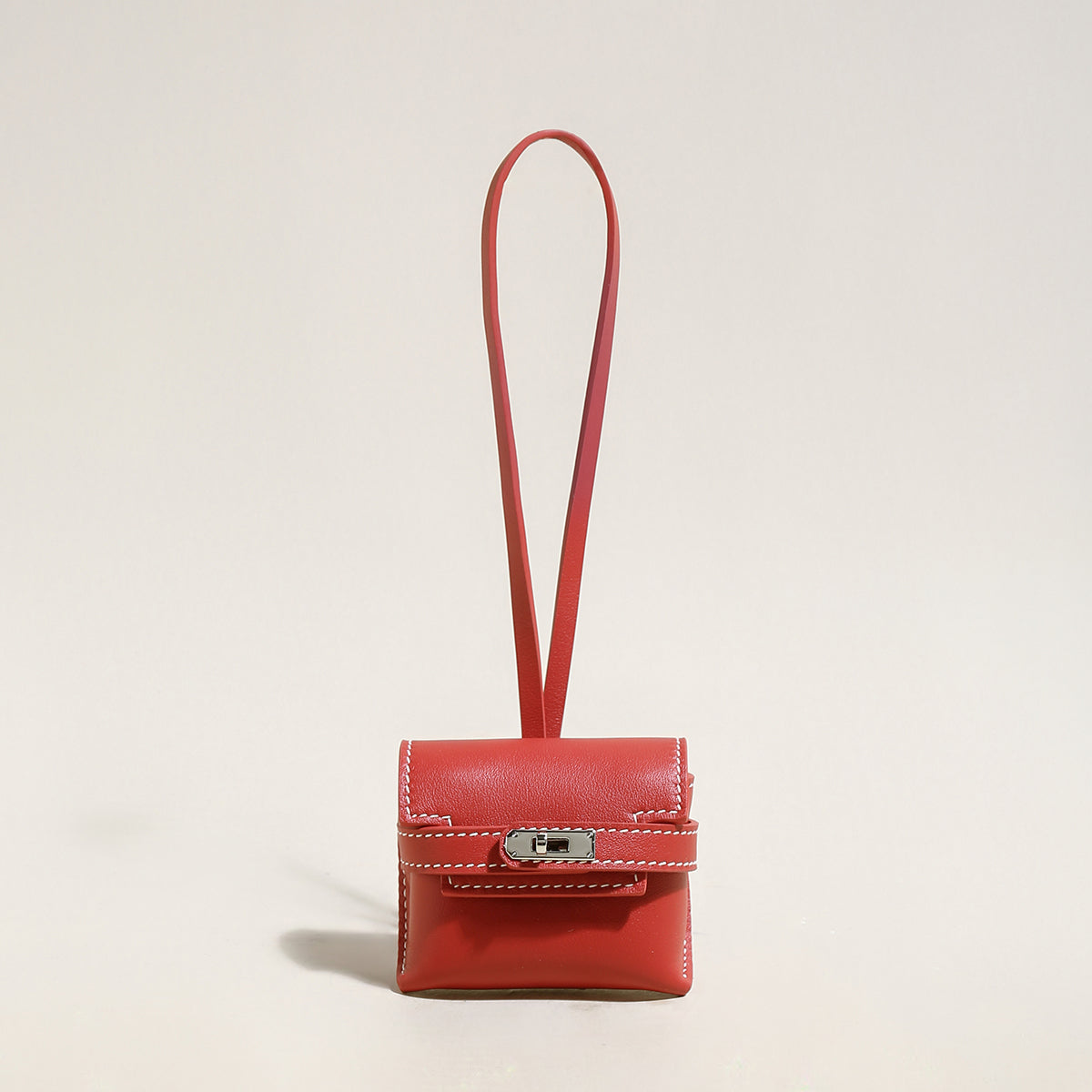 leather crafted airpods case wrist pouch red 1