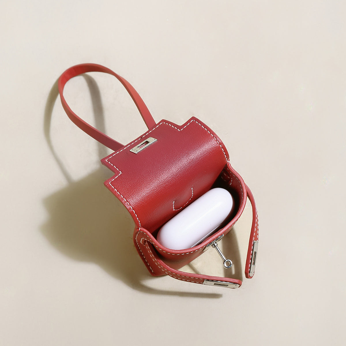 leather crafted airpods case wrist pouch red 4