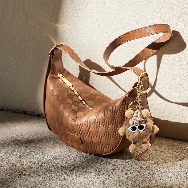 Luna Pompom Quilted Crescent Shoulder Bag