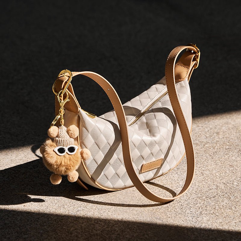 Luna Pompom Quilted Crescent Shoulder Bag