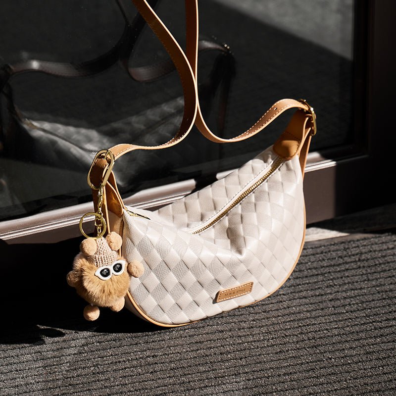 Luna Pompom Quilted Crescent Shoulder Bag