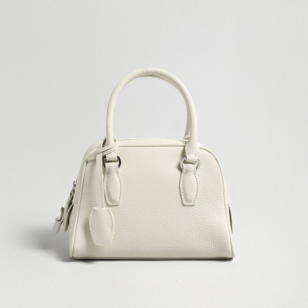 Mini Pebbled Leather Bowling Bag with Padlock Charm – Structured Top-Handle Crossbody Bag