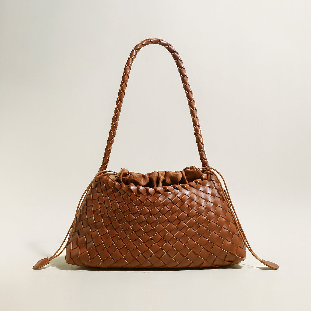 mini woven trapezoid drawstring shoudler bag brown 1