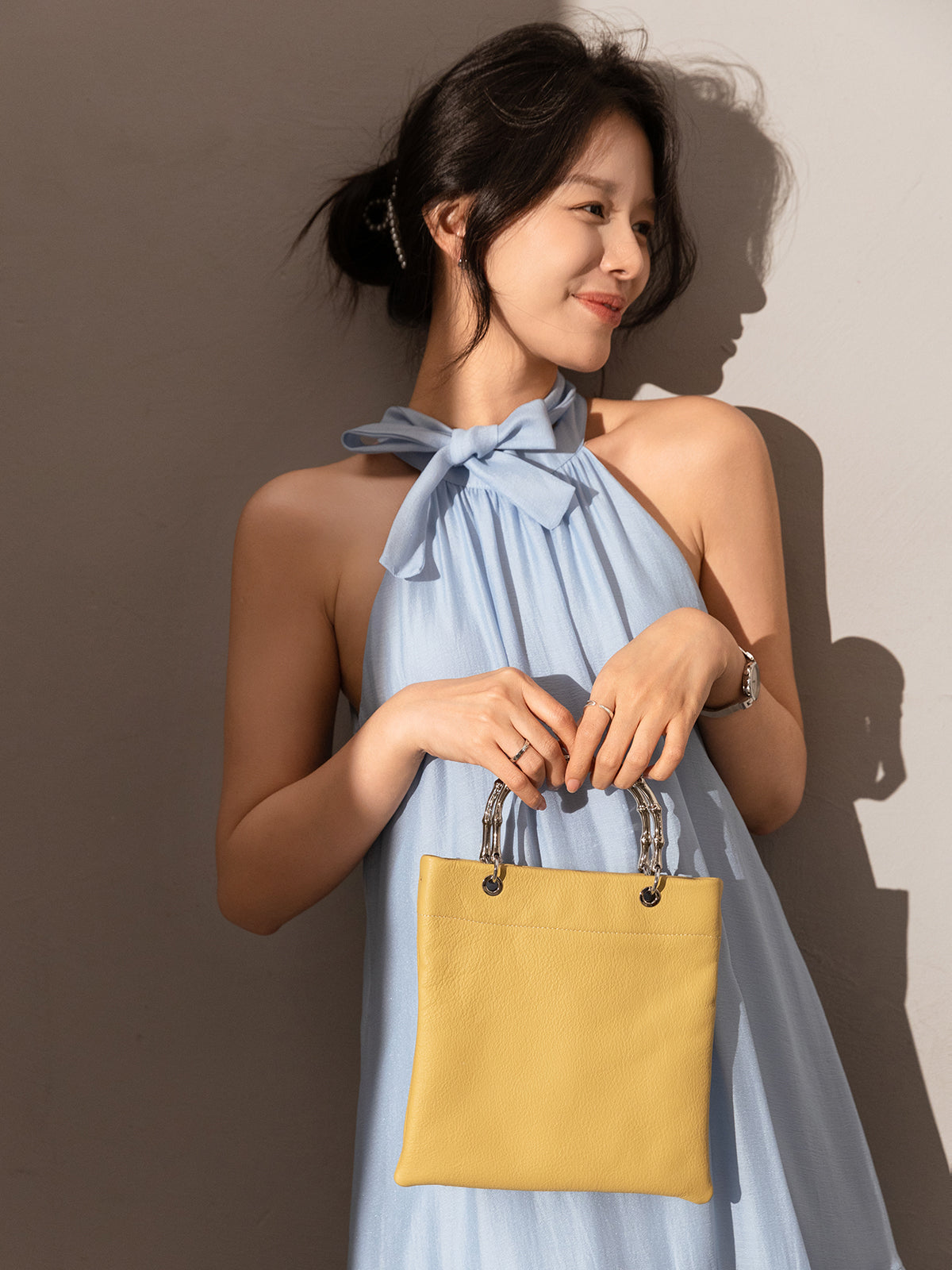 minimalistic square structured top handle bag yellow 2