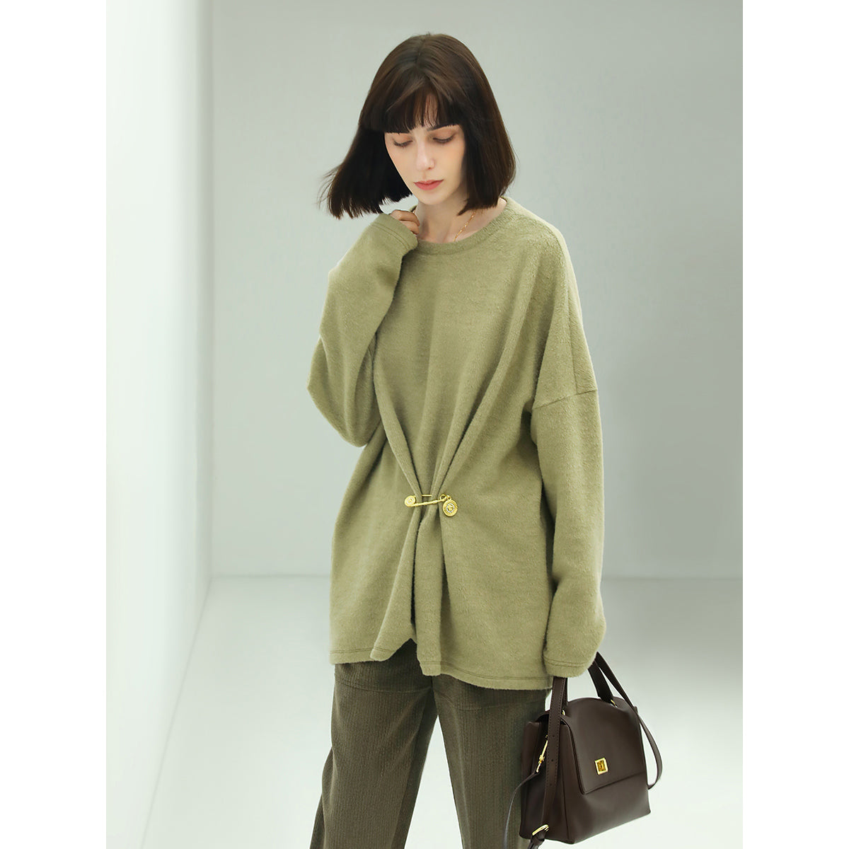 oversized green fleece knit with a stylish cinched brooch pin all green 1