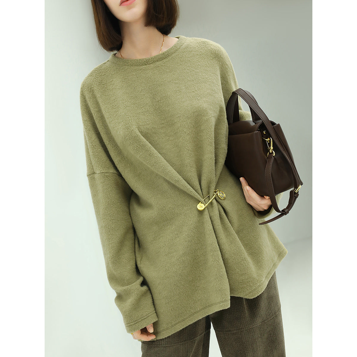 oversized green fleece knit with a stylish cinched brooch pin all green 2
