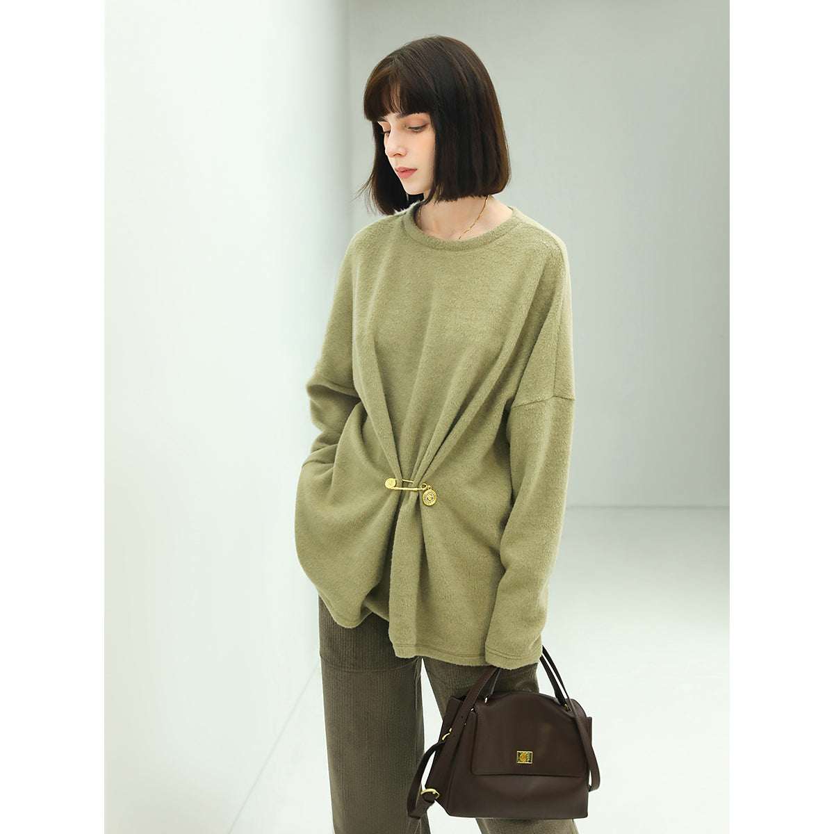 oversized green fleece knit with a stylish cinched brooch pin all green 3