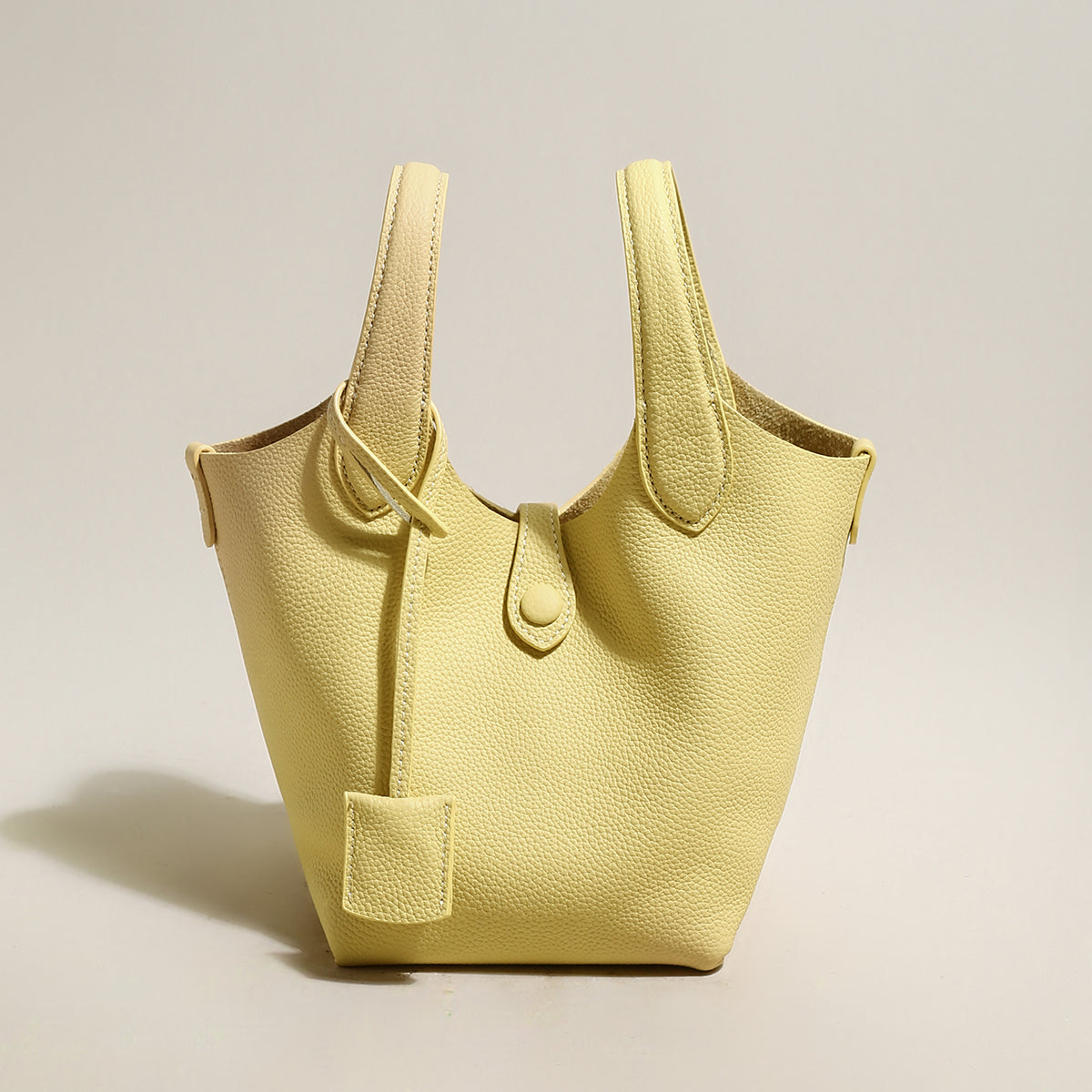 playful leather bucket bag yellow 1