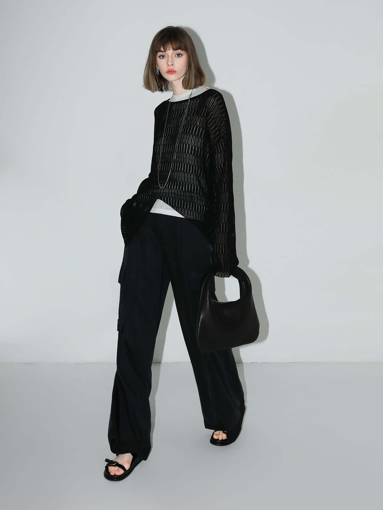 sheer knit top with asymmetrical hem all black 3