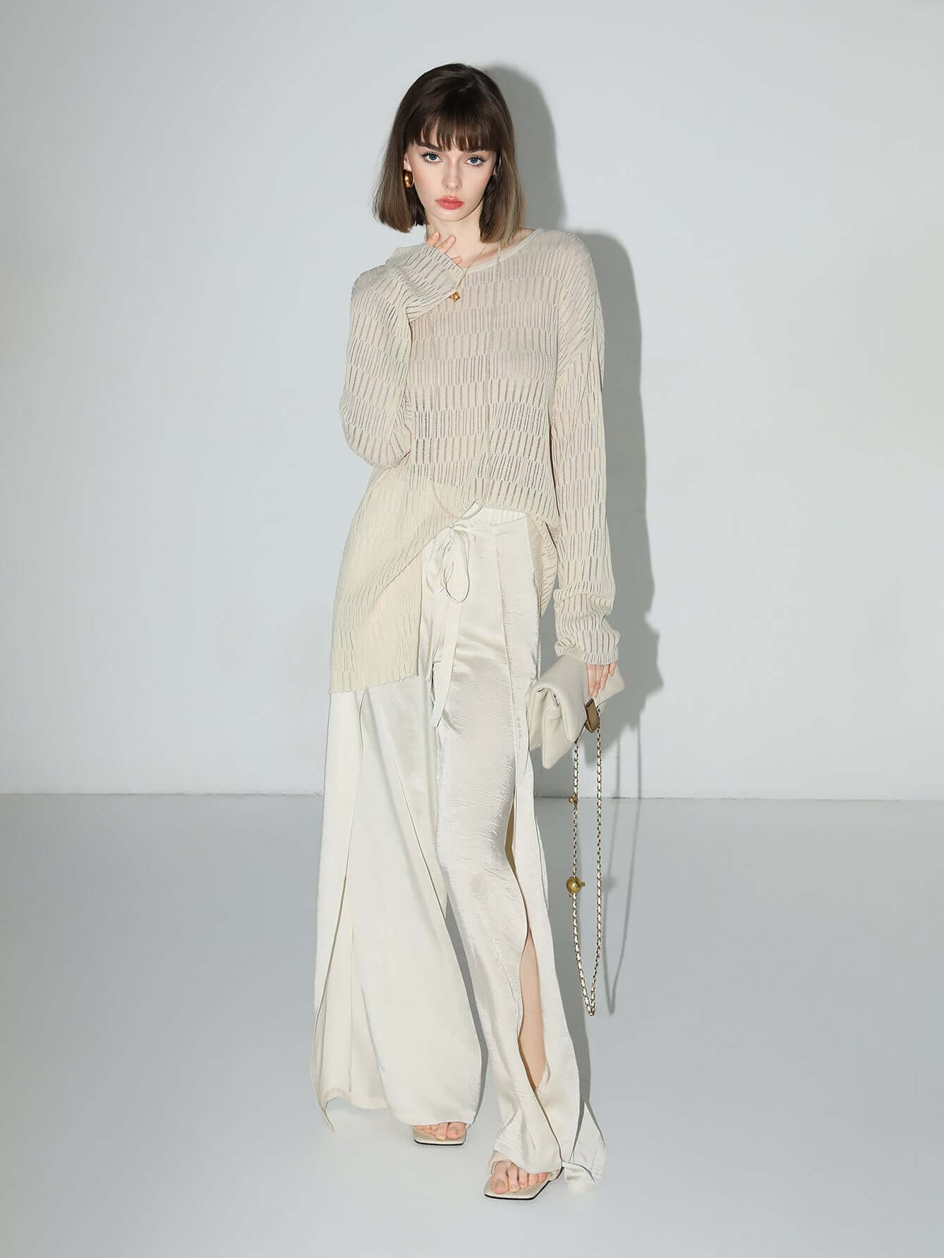 sheer knit top with asymmetrical hem all ivory 1