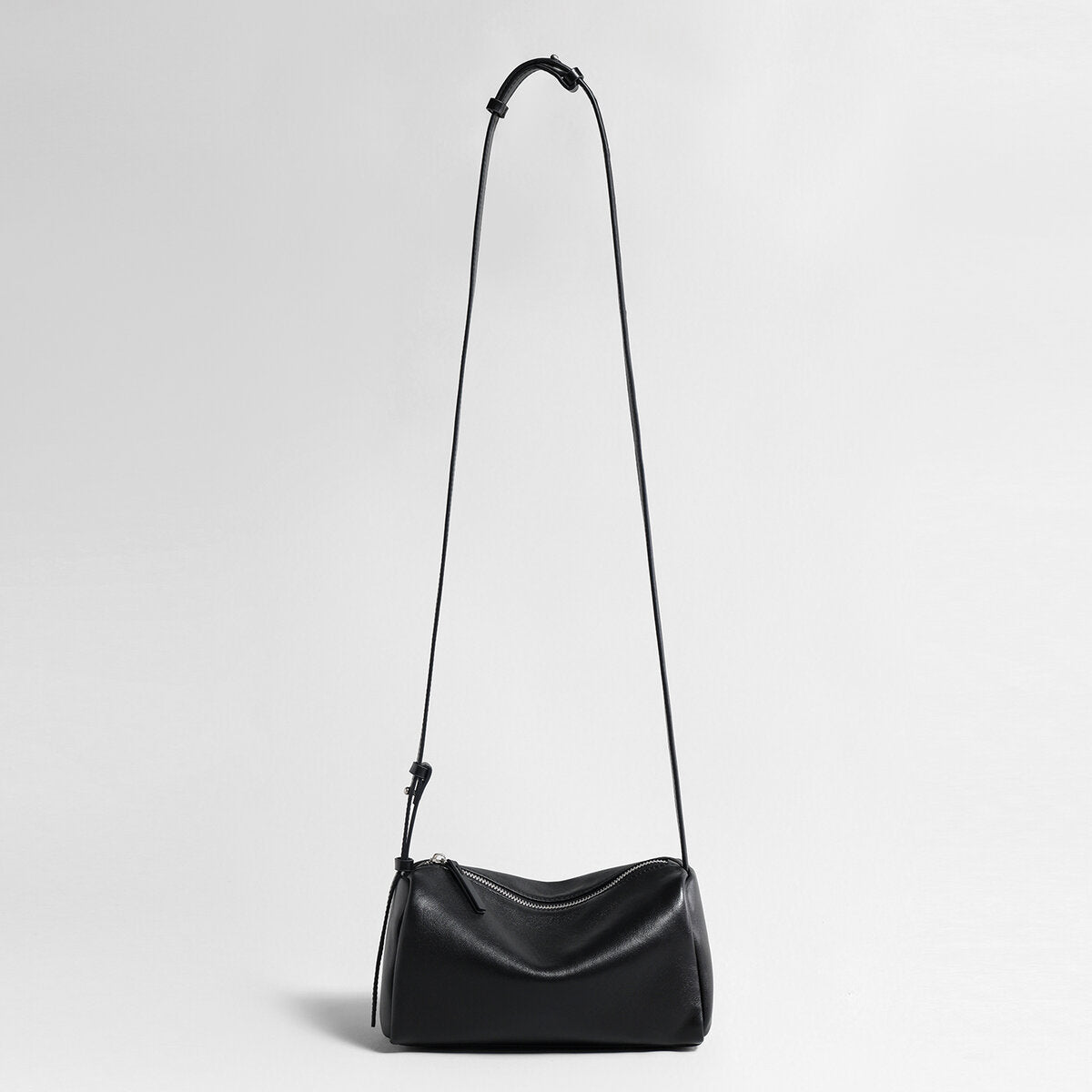Soft Lambskin Leather Barrel Shoulder Bag – Curved-Zip Cylinder Design with Adjustable Crossbody Strap