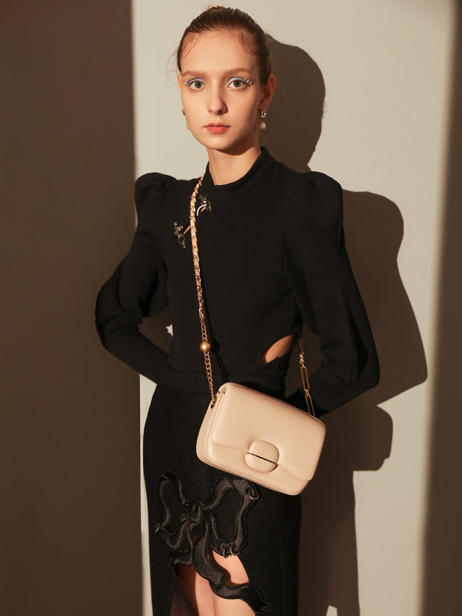 Structured Buckle Leather Shoulder Bag – Sculptural Lambskin Flap Bag with Gold Chain Strap
