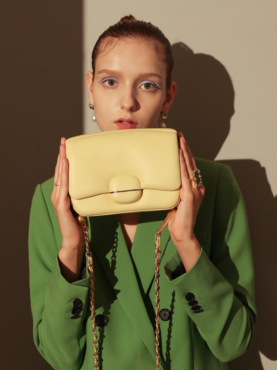 Structured Buckle Leather Shoulder Bag – Sculptural Lambskin Flap Bag with Gold Chain Strap