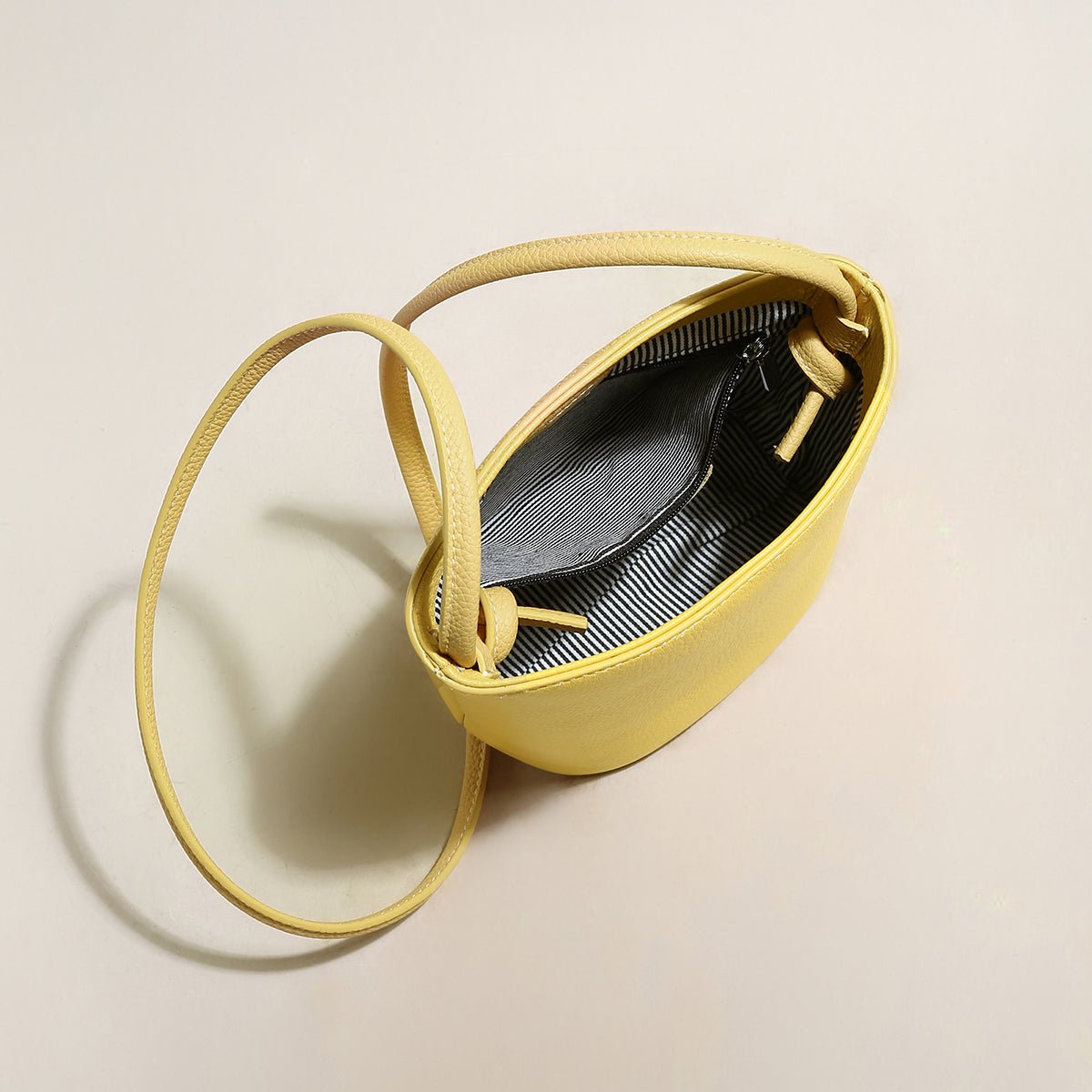 Thin Strap Waterproof Leather Bucket Bag – Minimalist Pebbled Leather Shoulder Bag with Knotted Detail