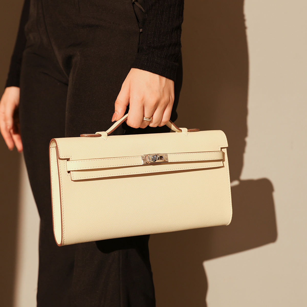 top-handle-leather-clutch-bag-with-silver-hardware_ivory_1.jpg