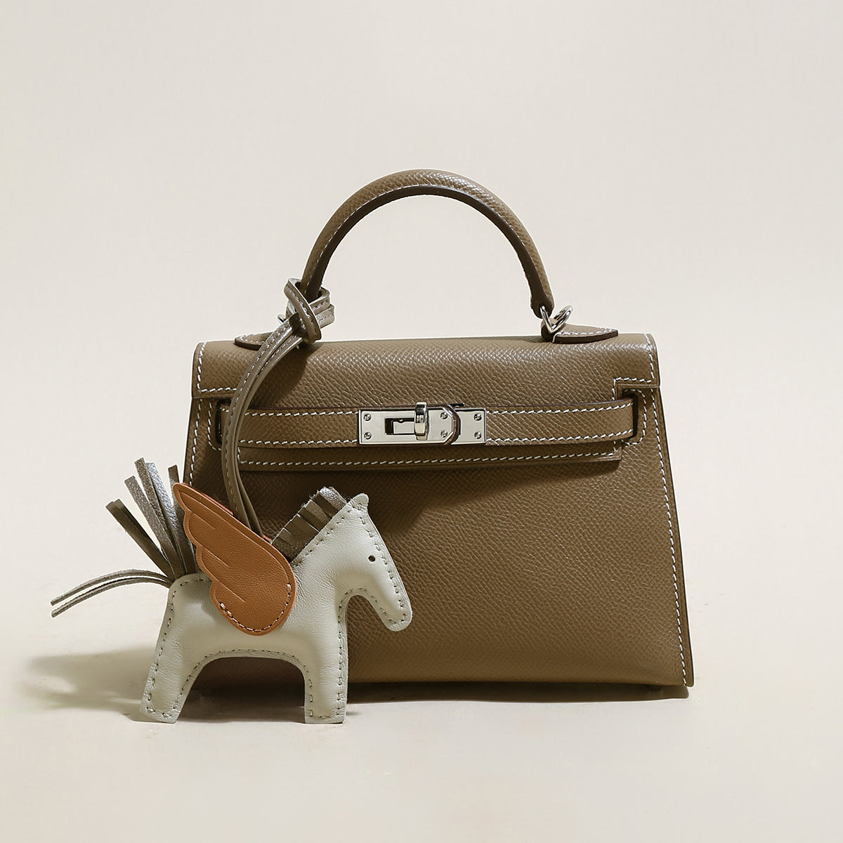 trendy petite top handle bag with a horse charm mocha 1