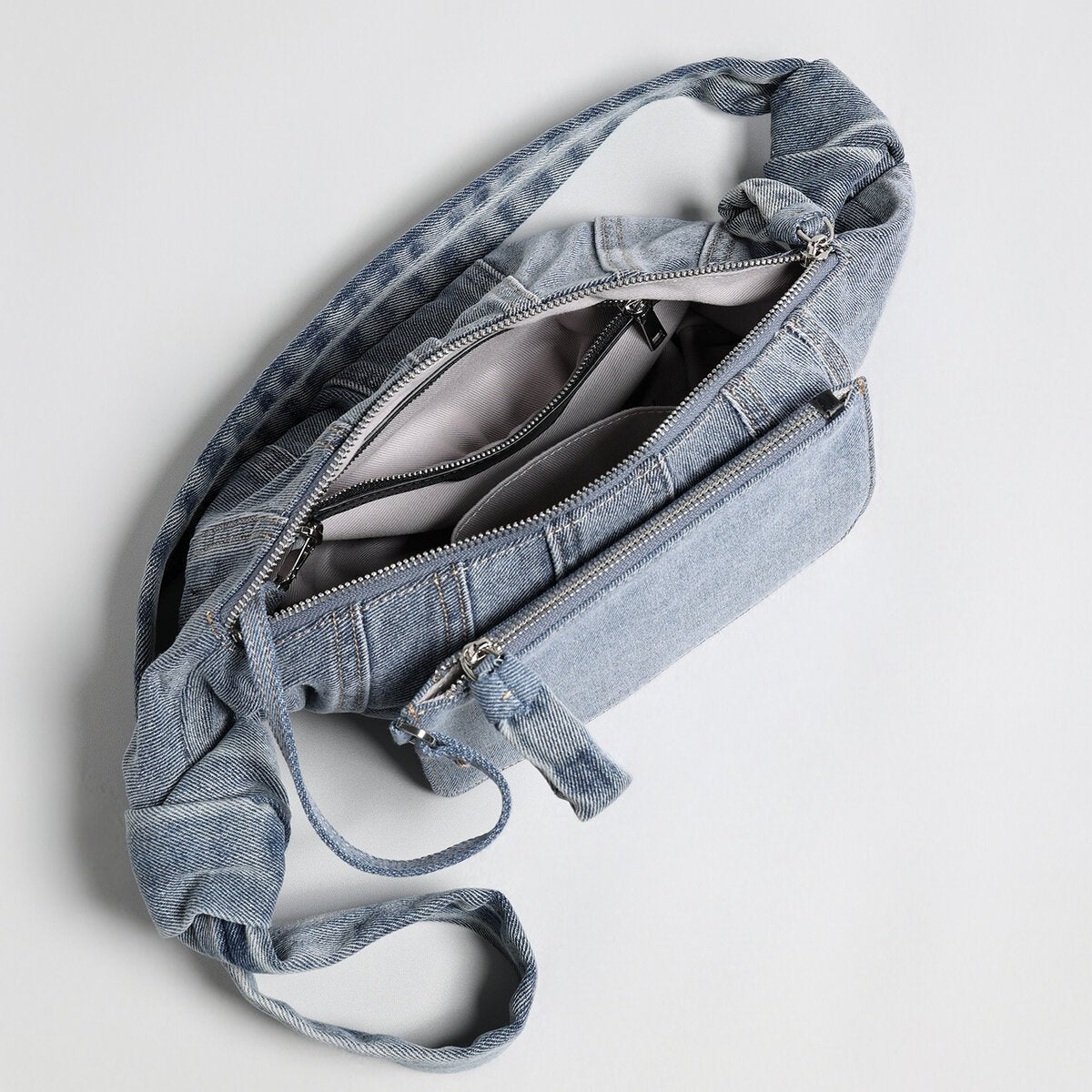 Washed Denim Croissant Shoulder Bag – Pleated Crescent Hobo with Knotted Strap Detail
