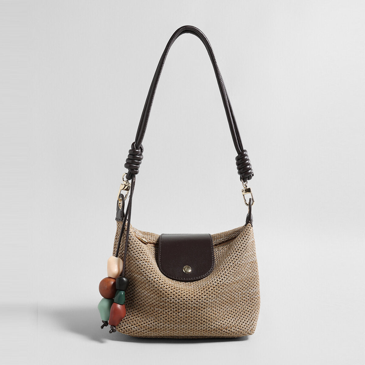 Woven Textile Shoulder Bag – Leather Flap, Beaded Charm & Convertible Strap