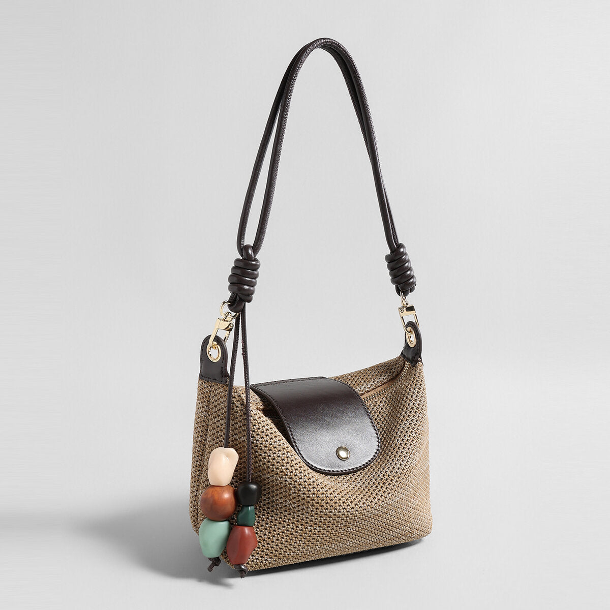 Woven Textile Shoulder Bag – Leather Flap, Beaded Charm & Convertible Strap