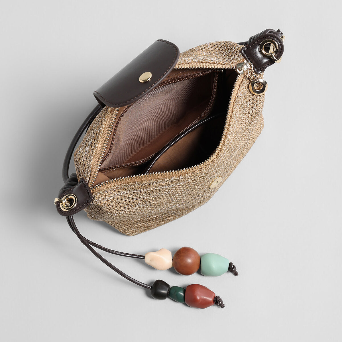Woven Textile Shoulder Bag – Leather Flap, Beaded Charm & Convertible Strap