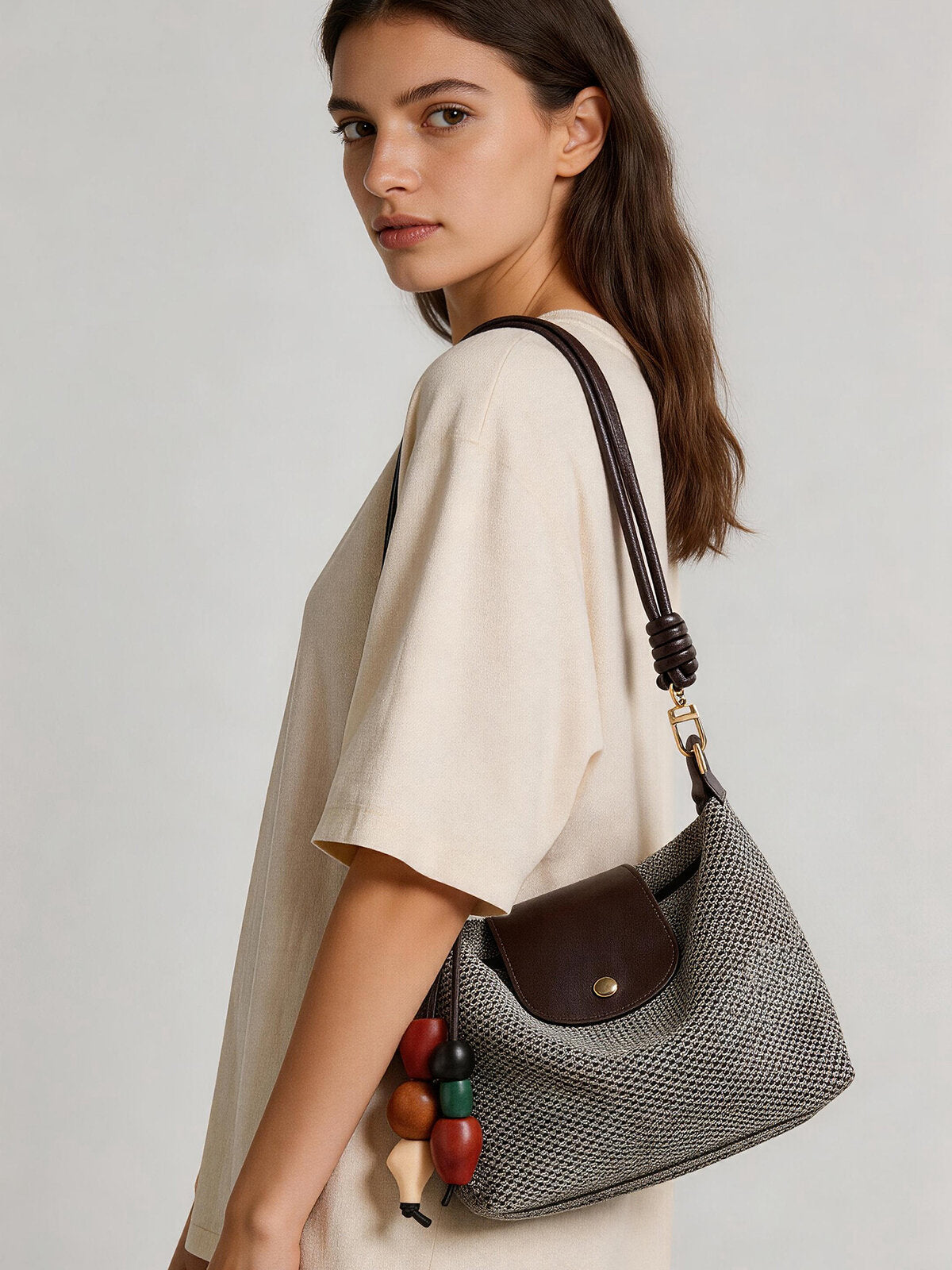 Woven Textile Shoulder Bag – Leather Flap, Beaded Charm & Convertible Strap